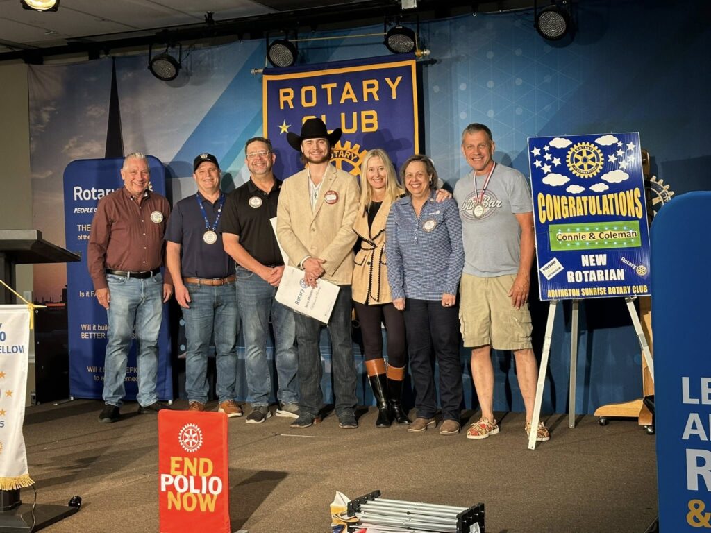 Arlington Sunrise Rotary welcomes a new Rotarian at a Friday club meeting