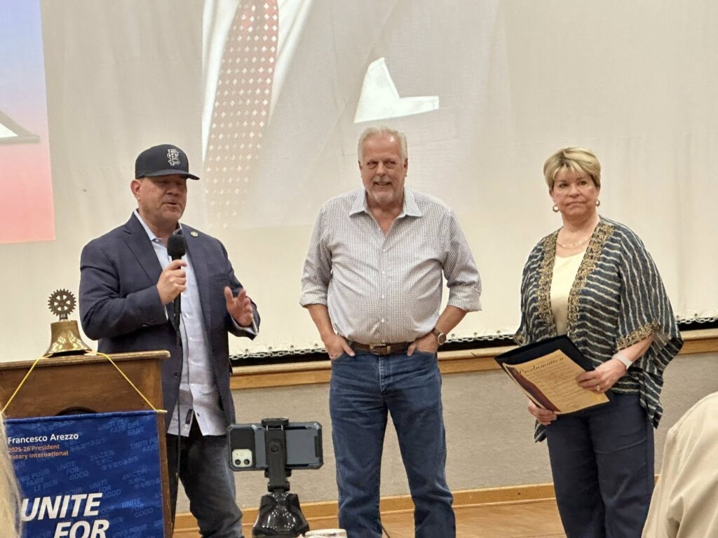Arlington Sunrise Rotarians recognized on stage at a Rotary Unite for Good event