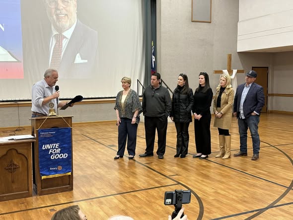 Honorees stand together during a recognition ceremony at a Rotary Unite for Good event