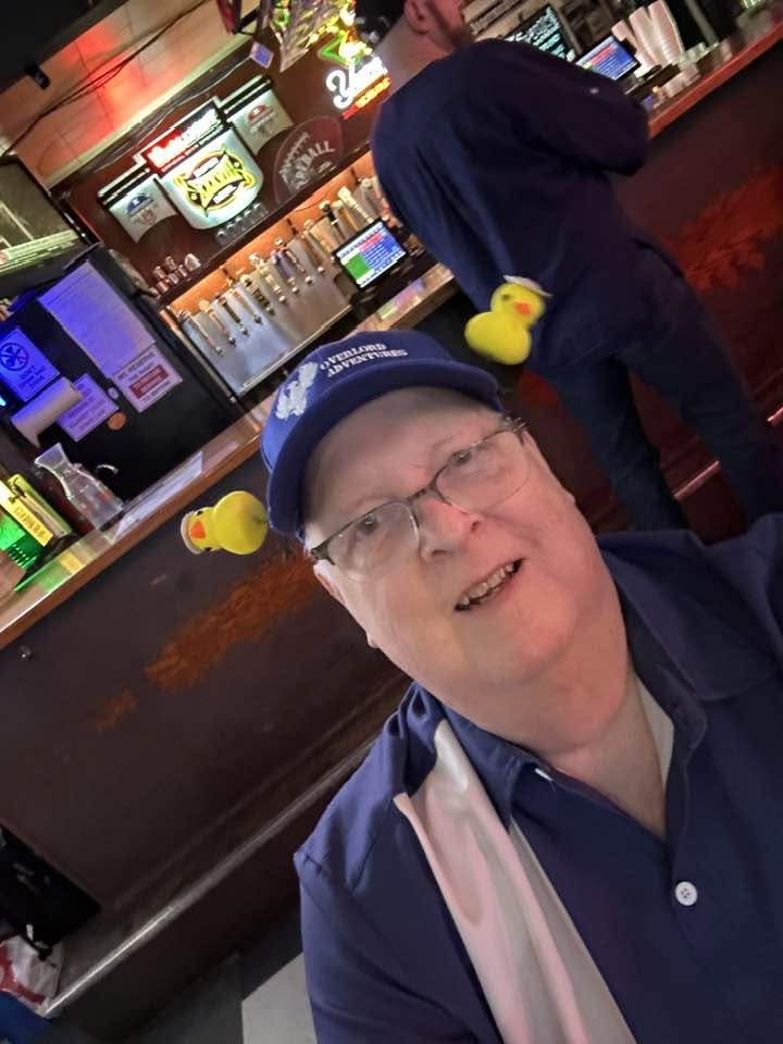 Arlington Sunrise Rotarian wearing a rubber duck at the duck race kickoff happy hour