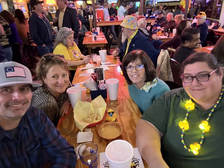 Arlington Sunrise Rotarians and friends at a festive evening get-together
