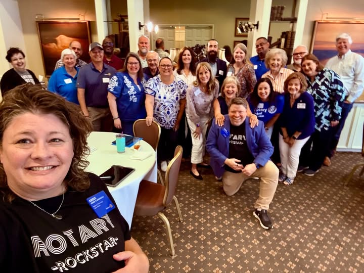 Arlington Sunrise Rotarians and friends pose for a group selfie at a Rotary gathering