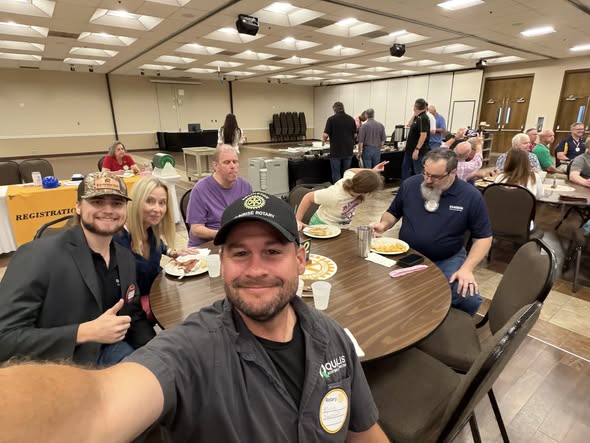 Arlington Sunrise Rotarians smile for a selfie at a Friday breakfast meeting