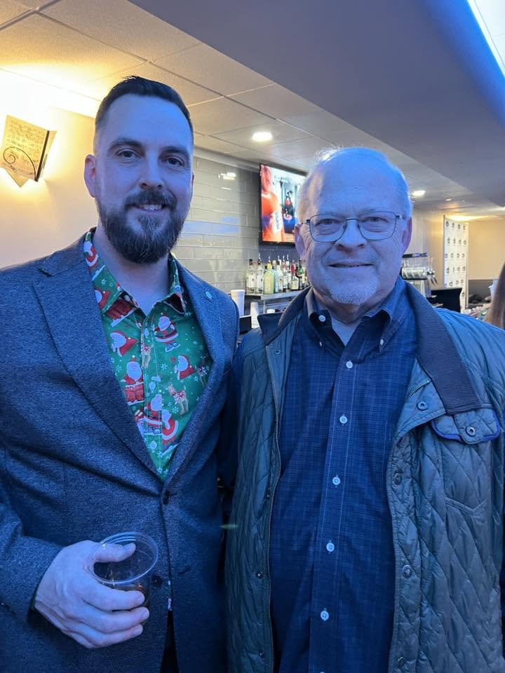 Arlington Sunrise Rotarians in holiday shirts at the club party