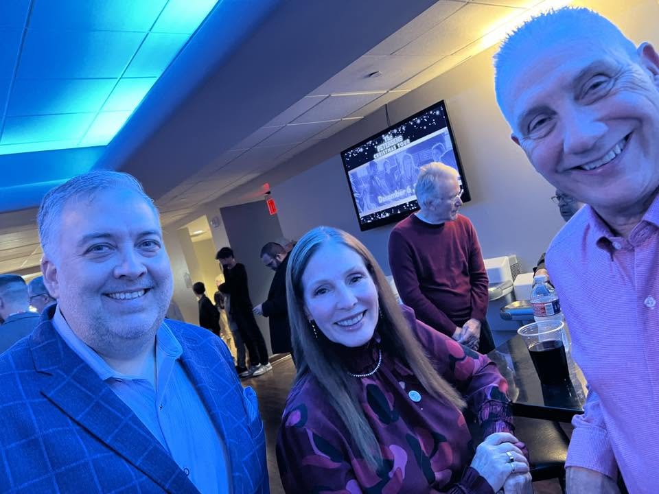 Arlington Sunrise Rotarians and guests take a group selfie at the holiday party