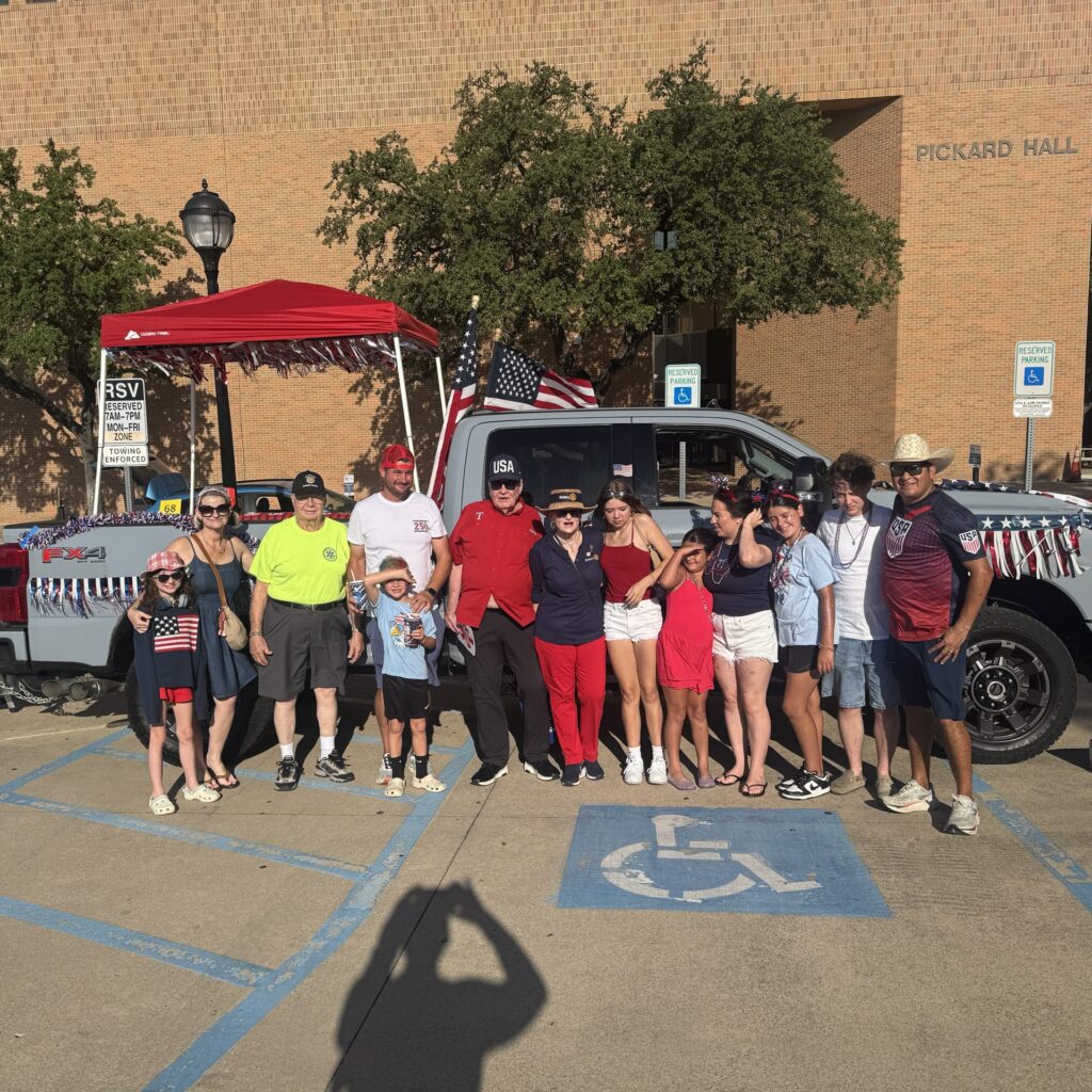 Arlington Sunrise Rotary members and families with the club float before the Fourth of July parade