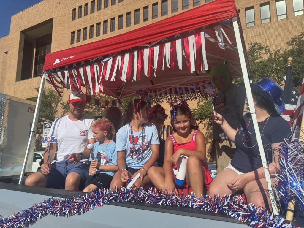 Arlington Sunrise Rotary members in the Fourth of July parade in downtown Arlington