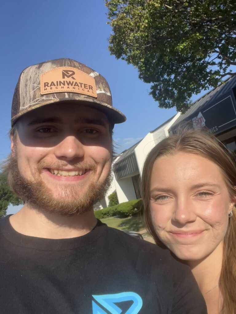 Young volunteers take a selfie at an Arlington Sunrise Rotary community event
