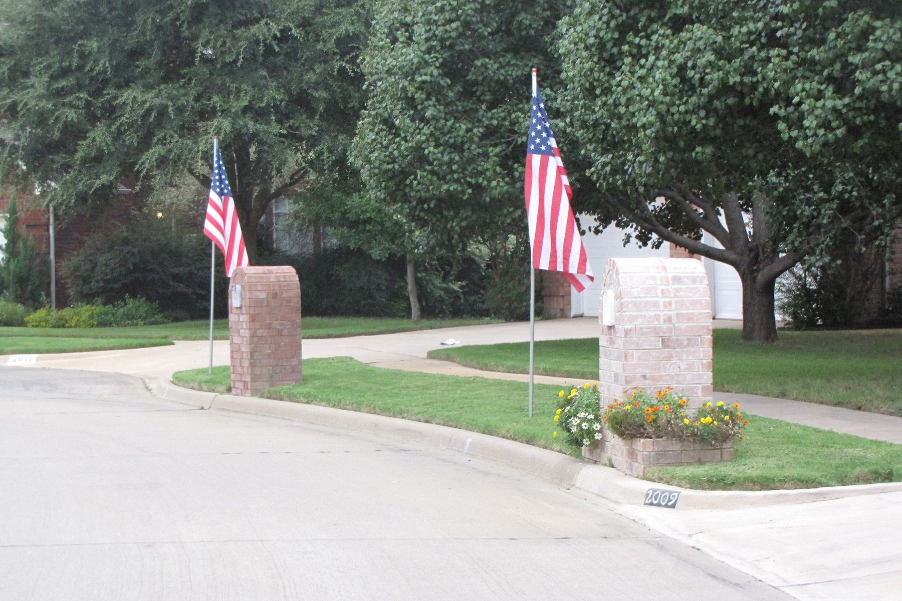 U.S. flags lining a neighborhood entrance