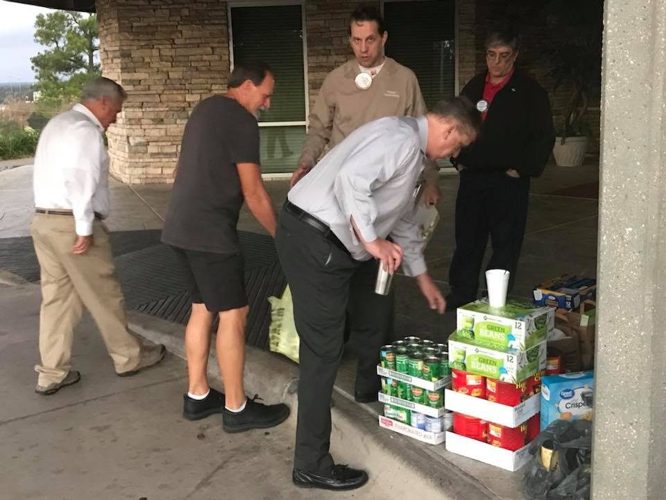 Members loading cans for Mission Arlington
