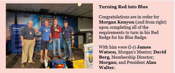 Morgan Kenyon receives his Blue Badge with his mentor, the membership director, and the club president